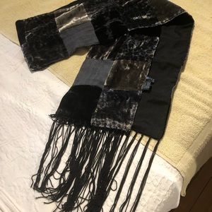 Scarf, black, blue, some brown. Tiled.
